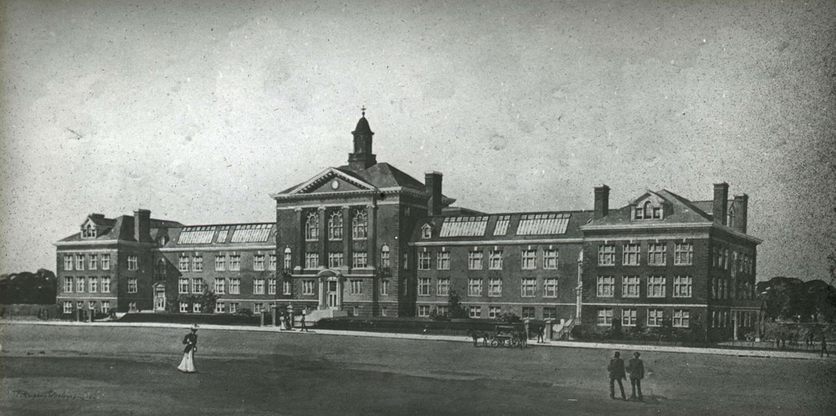 Black and white photo of a large brick high school building