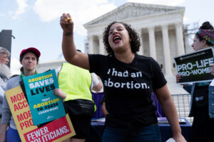 Abortion rights activists rally outside the Supreme Court holding signs like "Pro-Life, Pro-Women" and "Abortion saves lives"
