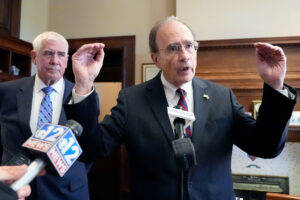 The Lieutenant Governor of Mississippi, Delbert Hosemann, poses with his hands out wide while speaking before a interviewer
