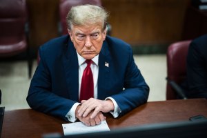 A view from above of former president Donald Trump sitting at a table in a court room