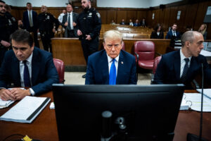 Former President Donald Trump, flanked by attorneys Todd Blanche and Emil Bove, appears at Manhattan criminal court