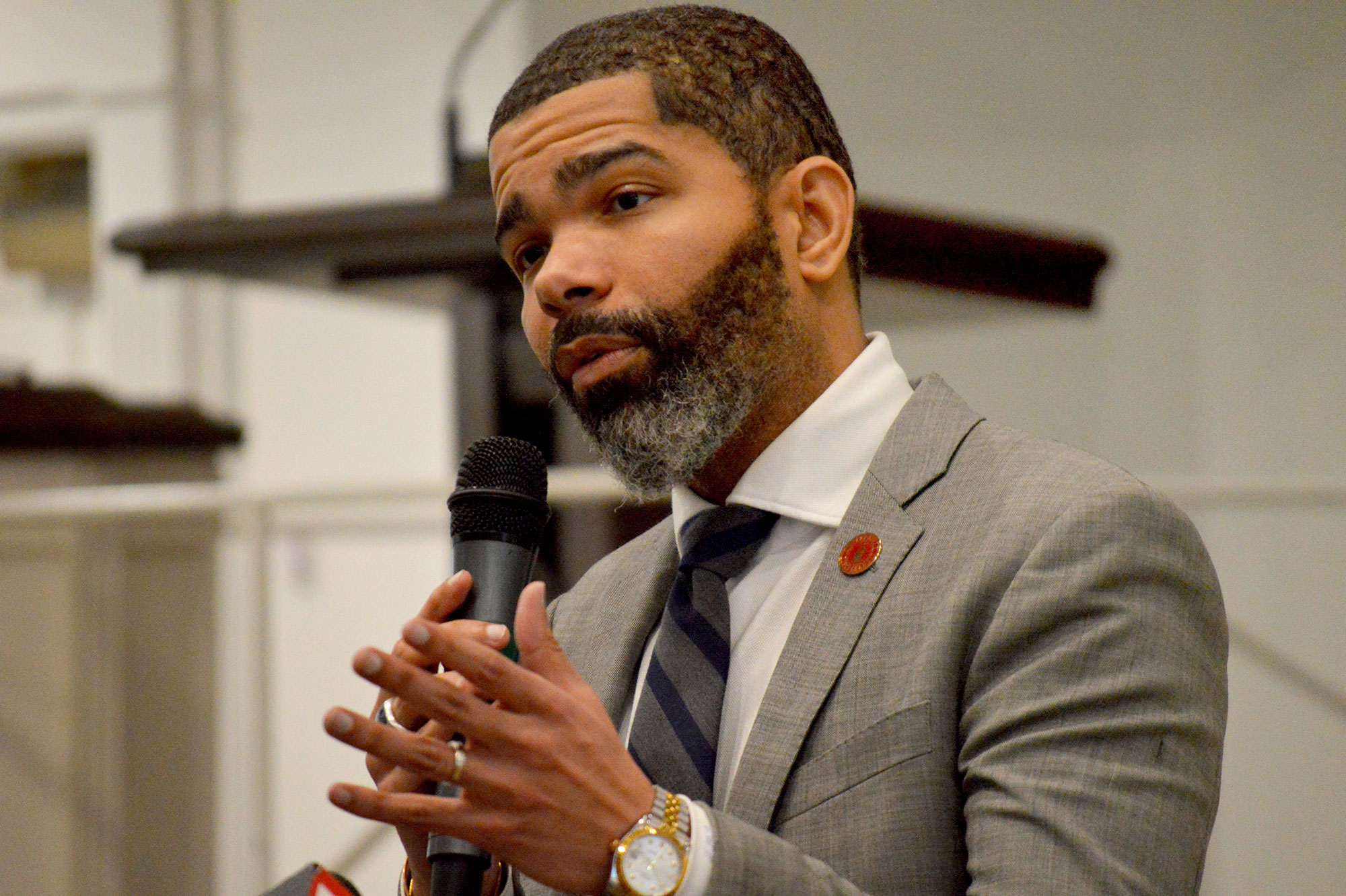 Mayor Chokwe A. Lumumba speaking with mic in hand