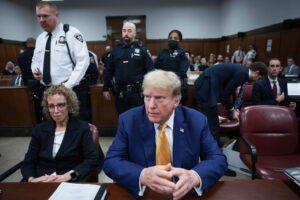 Former President Donald Trump, center, and attorney Susan Necheles, left, attend his trial at Manhattan criminal court