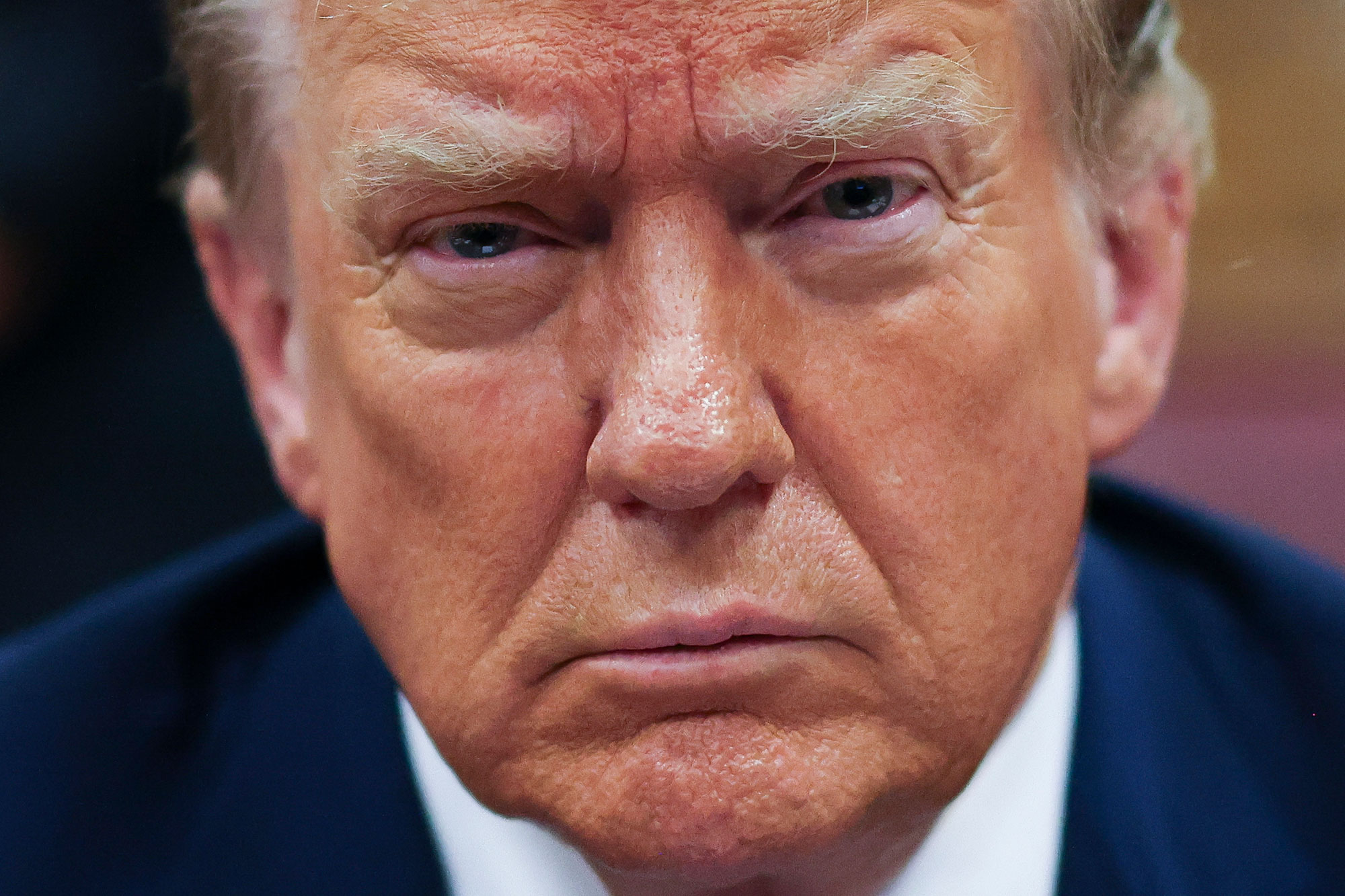 An extreme closeup of former president Donald Trump's face