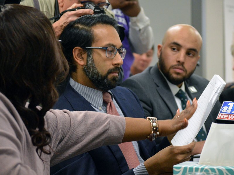 McGee showing ballot reports to voting rights attorney Amir Badat