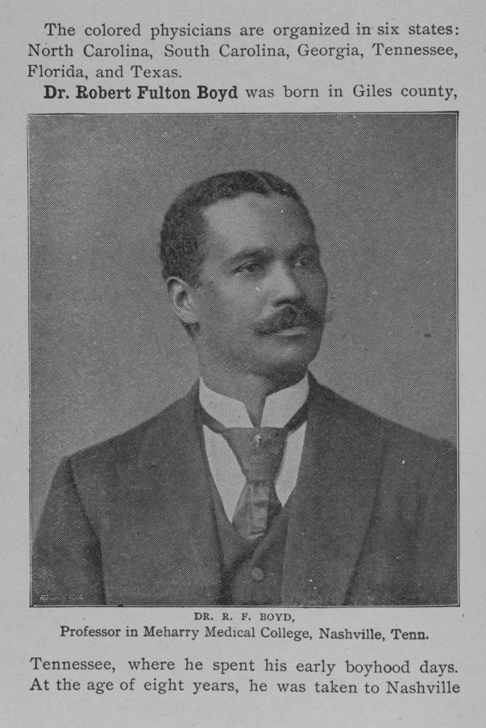 A Black man wearing a business suit poses for a portrait.