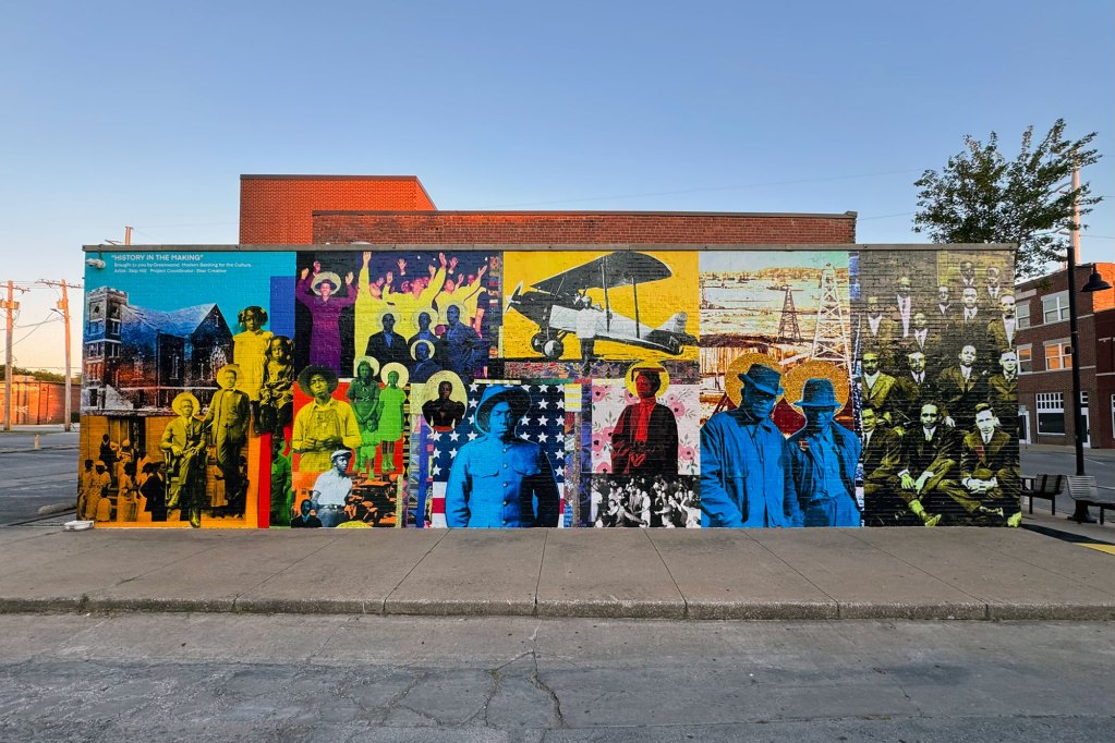 A very colorful mural on the side of a building