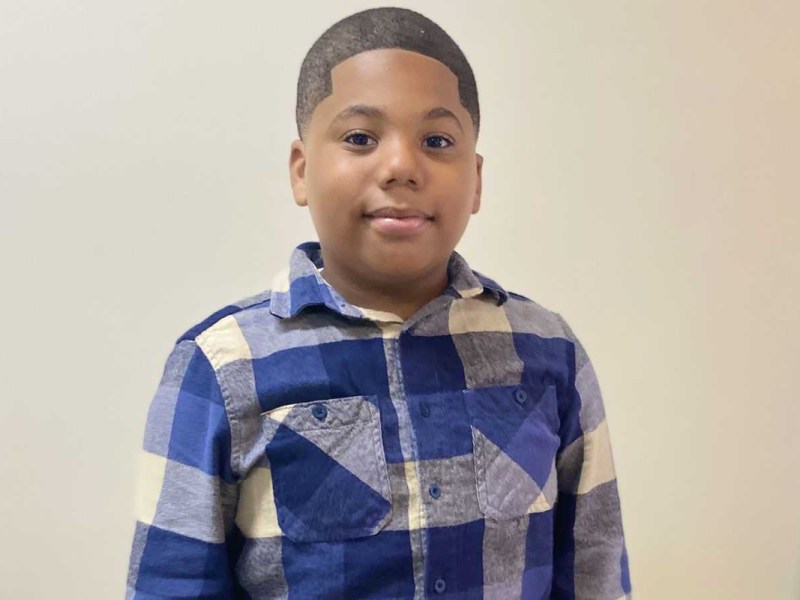 Aderrien Murry wearing a blue and white plaid shirt