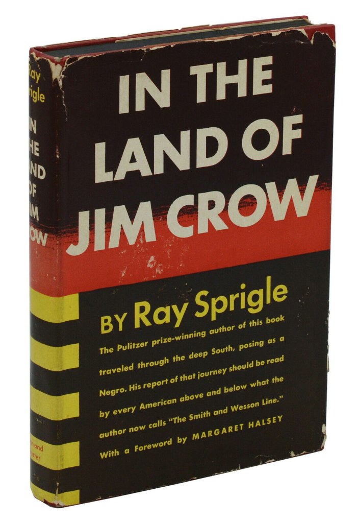 "Black, white and yellow book cover with the bold text reading 'In the Land of Jim Crow.'