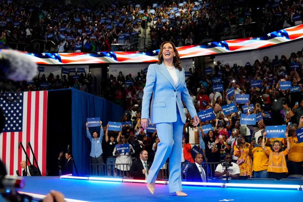 Vice President Kamala Harris admires the stadium crowd during a campaign rally,