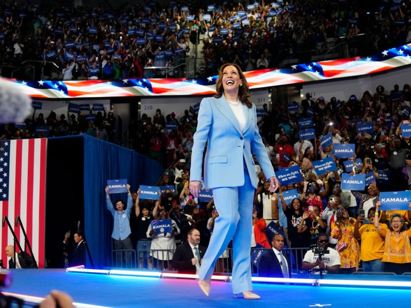 Vice President Kamala Harris admires the stadium crowd during a campaign rally,