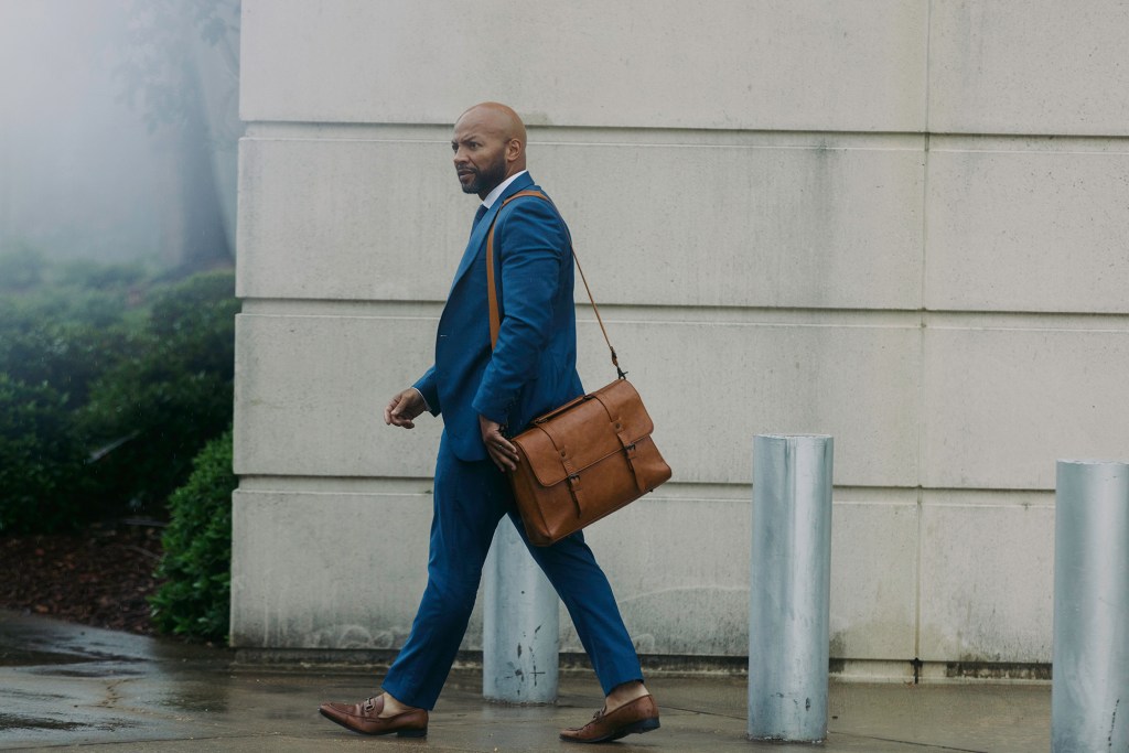 Lawyer walking out of a courthouse.
