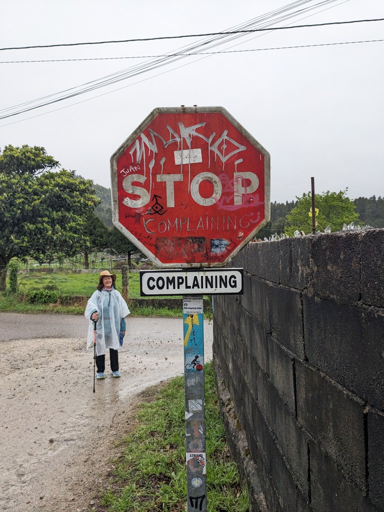 Woman standing next to a stop sign in El Camino