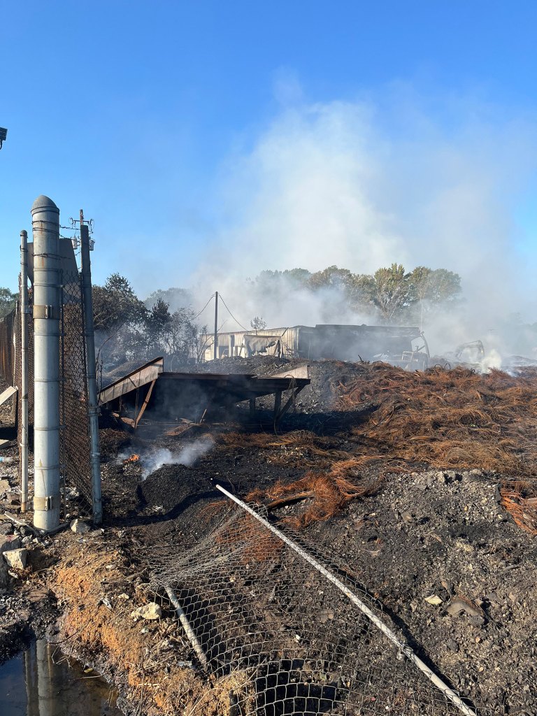 Tire plant on fire, with lots of debris on the ground