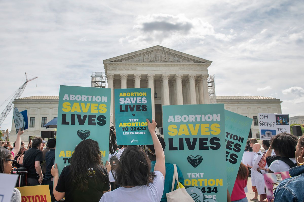 A crowd holds an "abortion is healthcare" rally in front of the Supreme Court