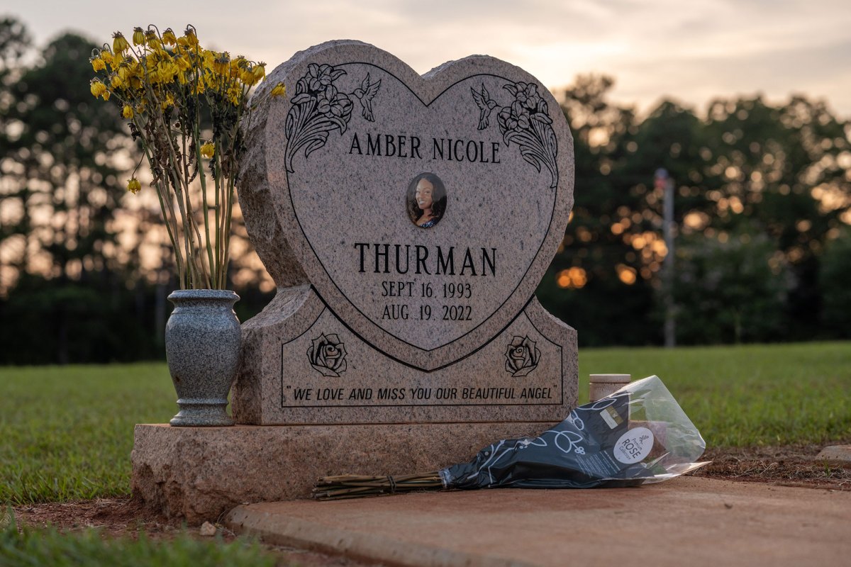 A close up view of a headstone that reads Amber Nicole Thurman Sept 16, 1993 - Aug 19, 2022