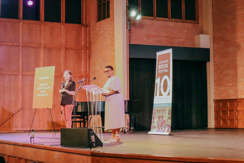 Photos of a talk given inside an auditorium