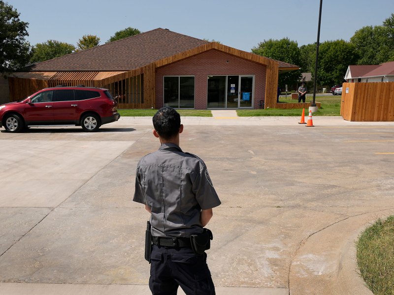 Security personnel stand outside a recently opened Planned Parenthood clinic