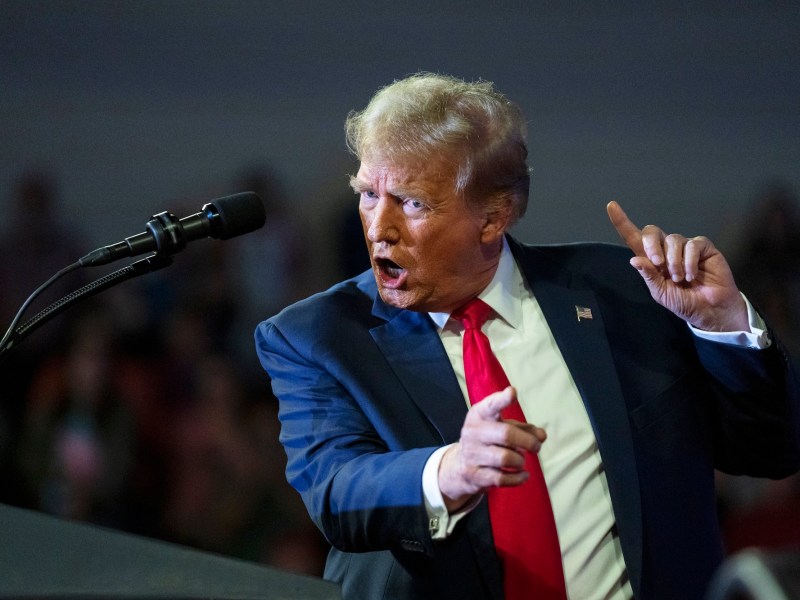 donald trump speaking at a podium