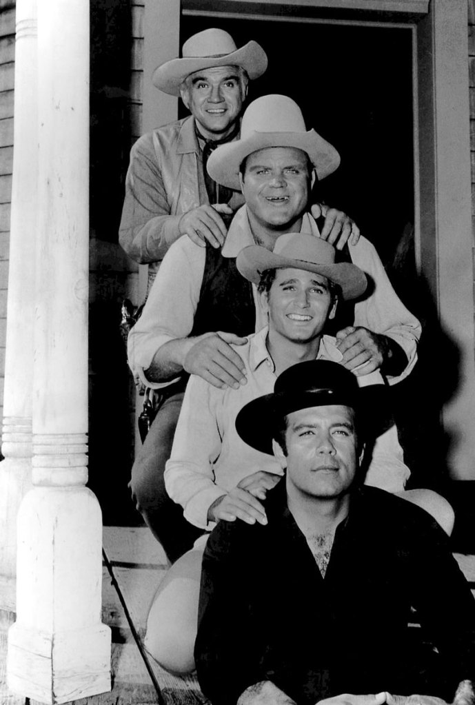 the full cast of the television program Bonanza on the porch of the Pondarosa