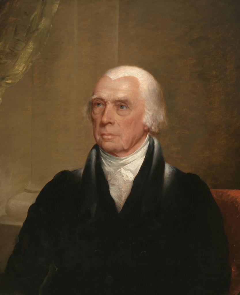 A man in formal dress and a colonial hairstyle