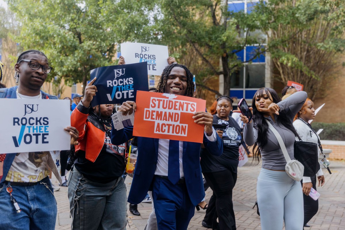 JSU students on plaza holding election signs