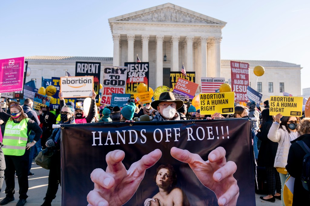 Personhood rally in Boulder, Colorado with bold sign in front that reads "Hands Off Roe!!!"