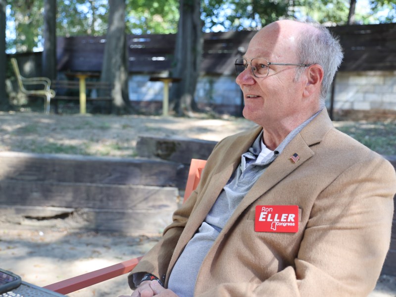 a photo of Ron Eller sitting on an outdoor chair