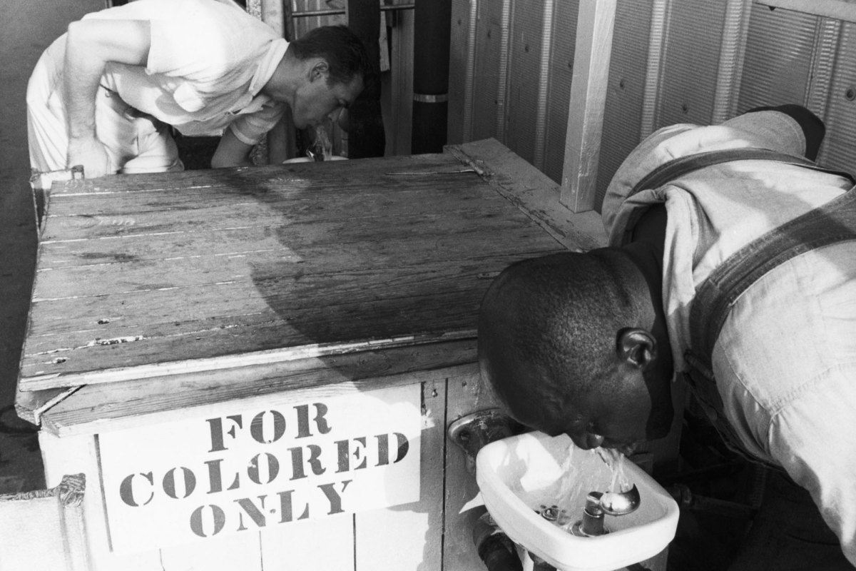 Segregated drinking fountain in use in the American South