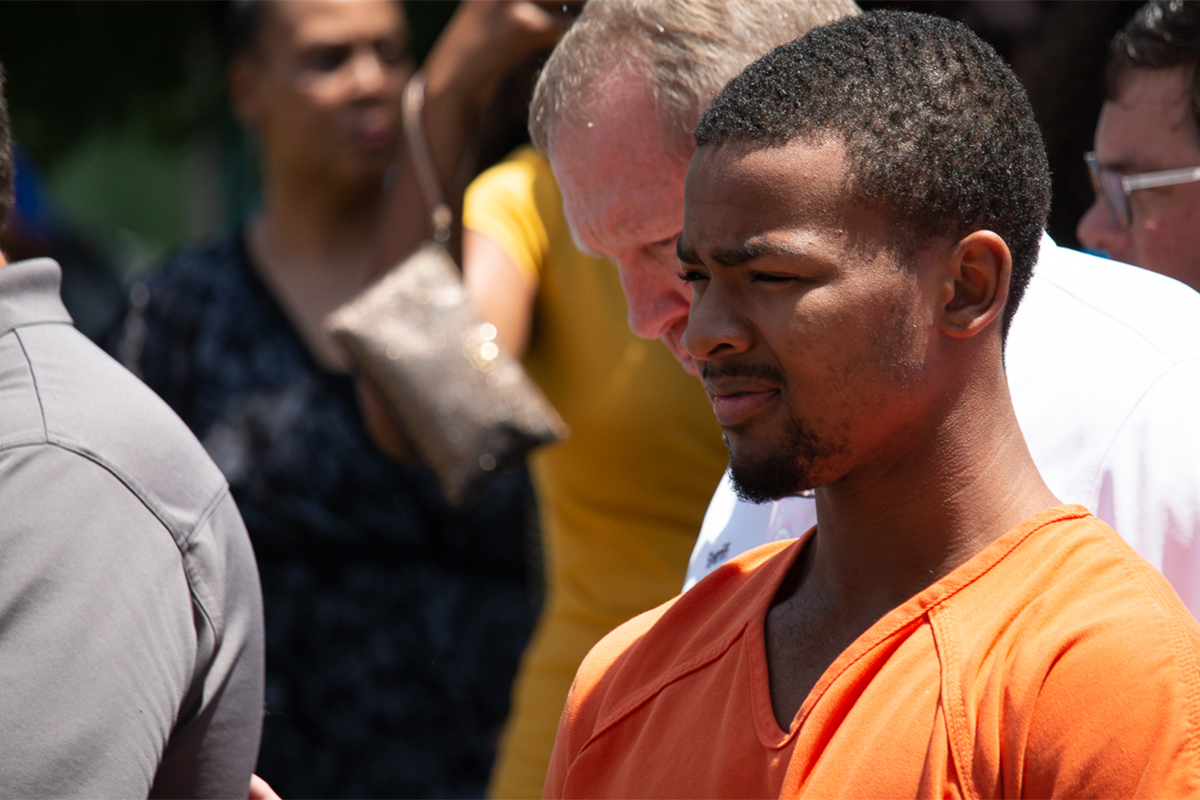 Sheldon Timothy Herrington Jr in an orange jumpsuit
