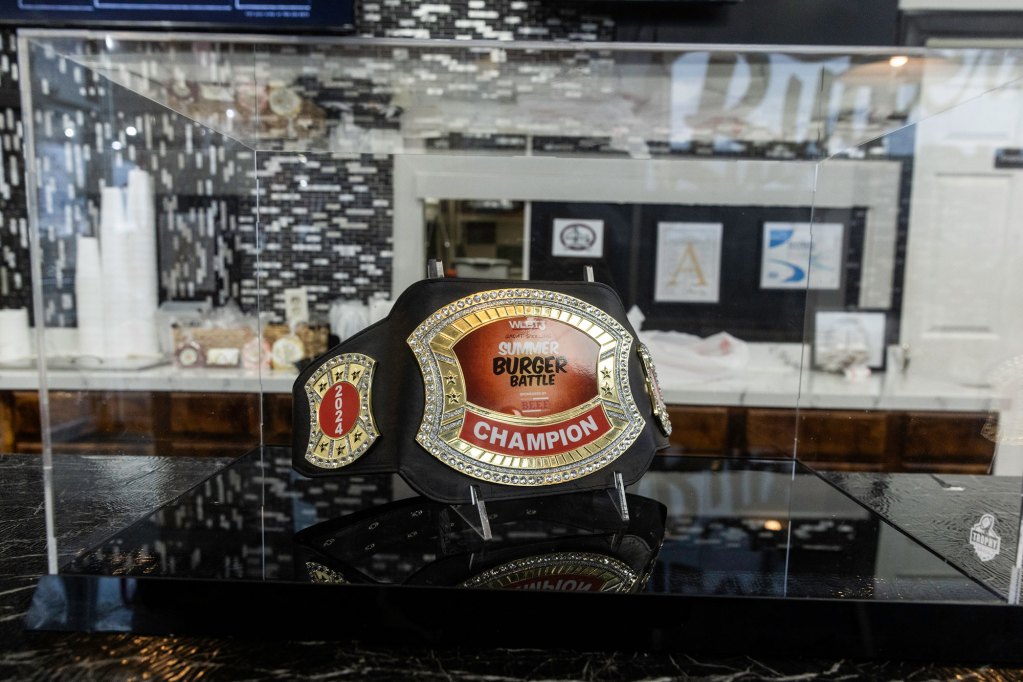 Championship belt for best burgers inside of a restaurant.