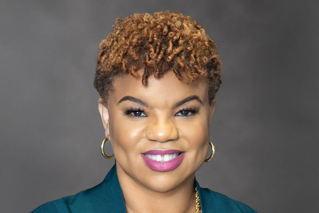 a photo of a woman smiling in a portrait