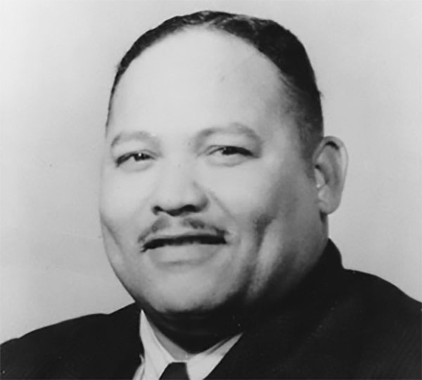 I closeup of a man in a suit in this black and white photo