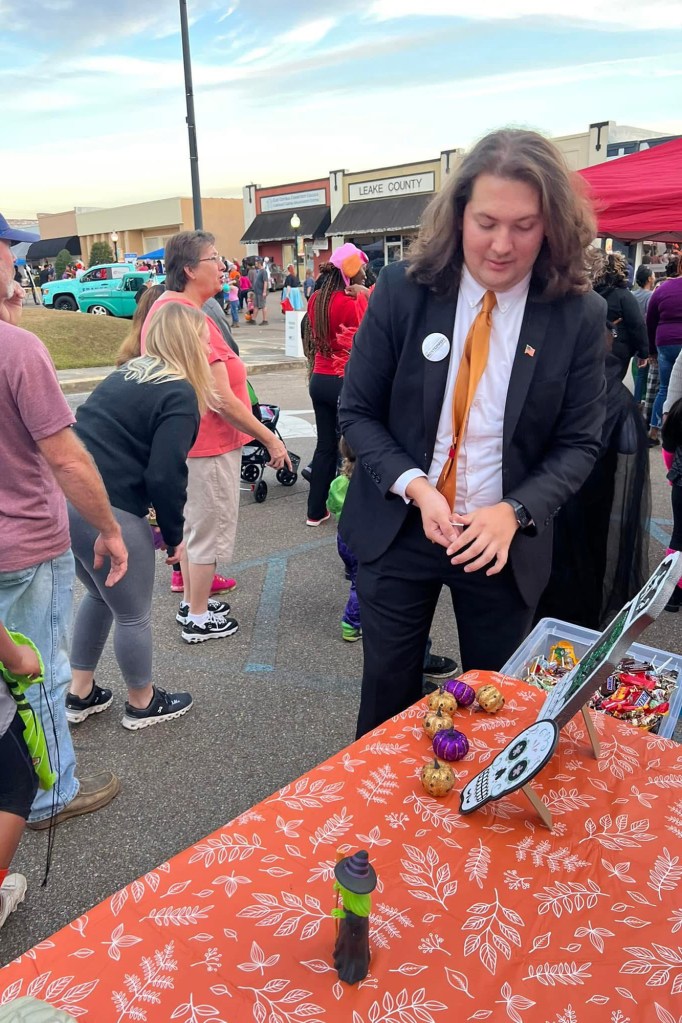 Man volunteering at a community event.