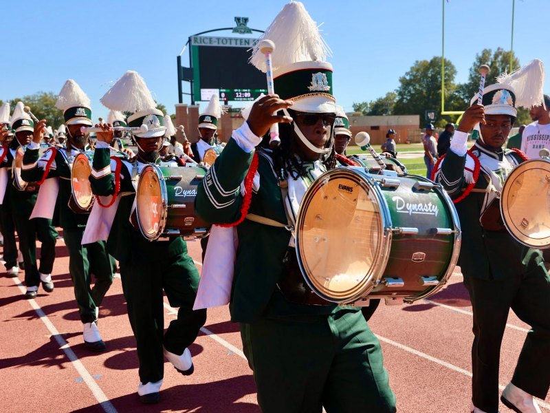 Mississippi Valley State University Band performing on the track around a football field