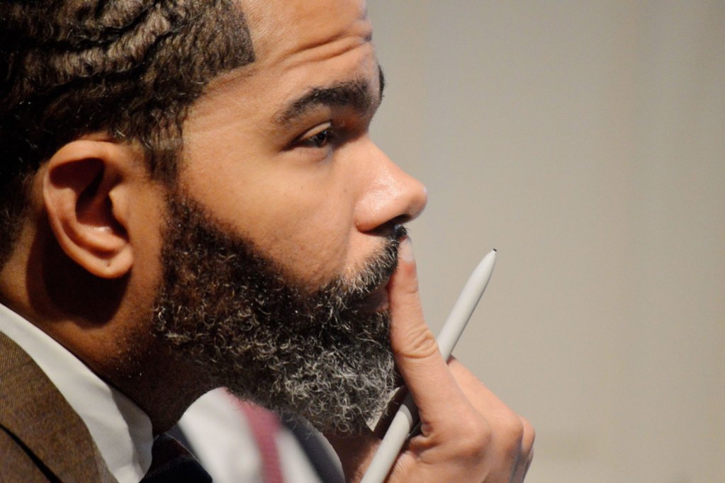 Mayor of Jackson, Mississippi sits while pondering at a Council meeting