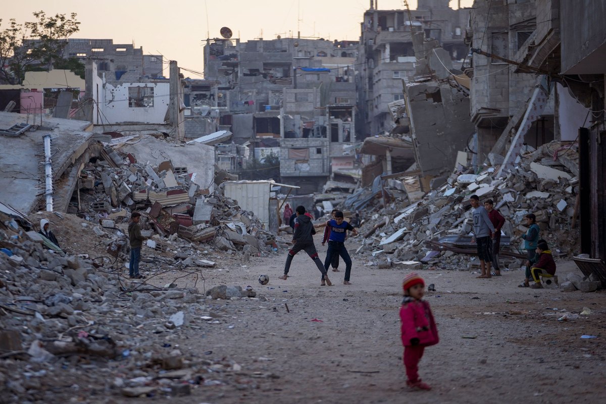 Children play in war torn neighborhood