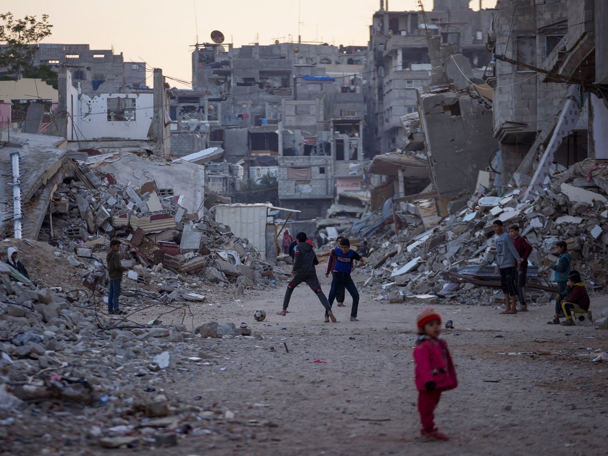 Children play in war torn neighborhood