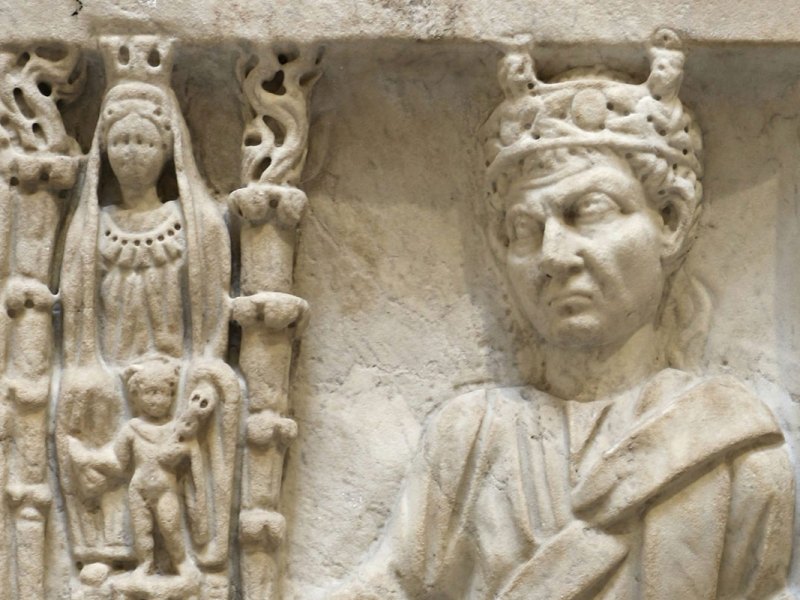 A relief in white stone showing two figures