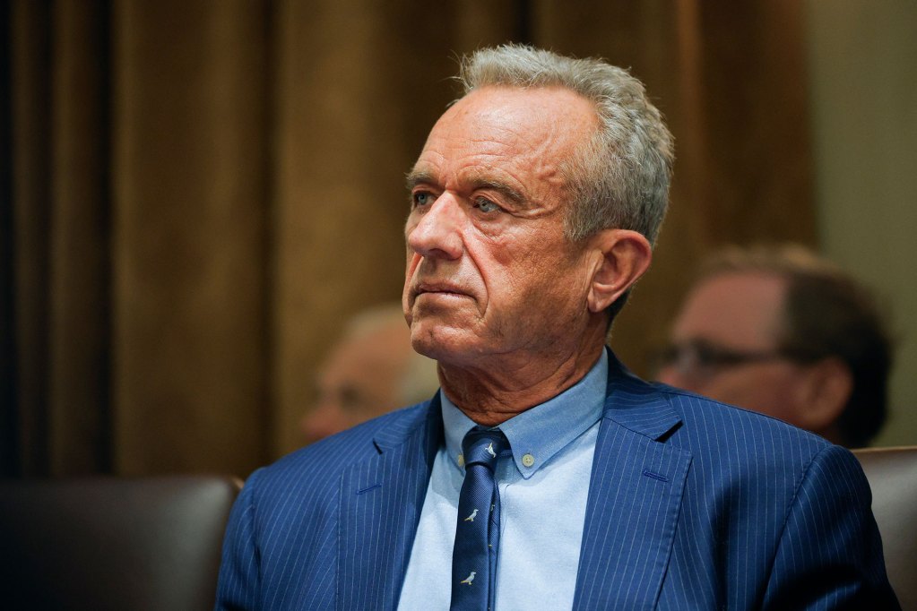 Closeup of an older man in a blue suit and tie