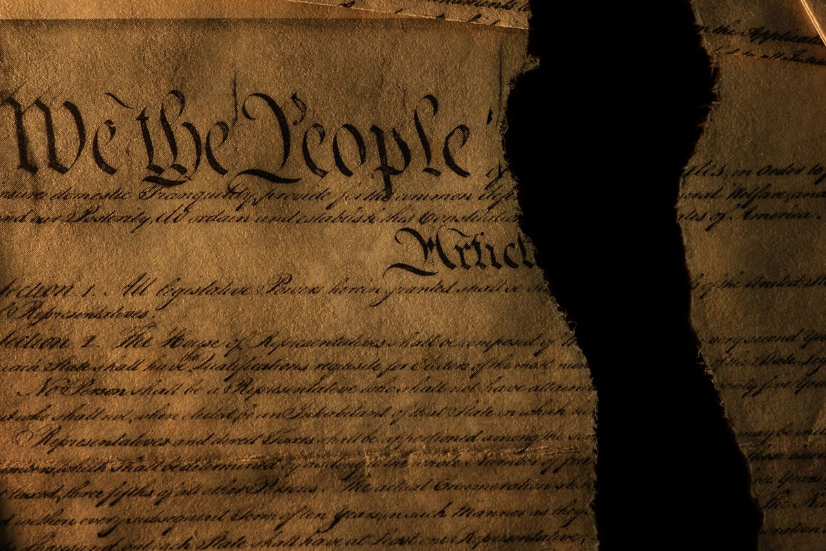 An image of the US constitution, torn in half