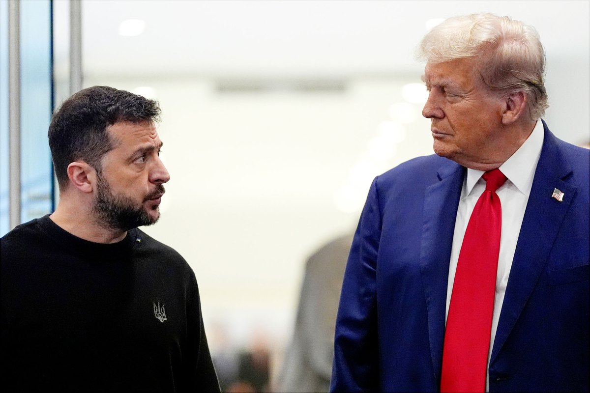 Two presidents look at each other, one in casual black attire and the other in a suit