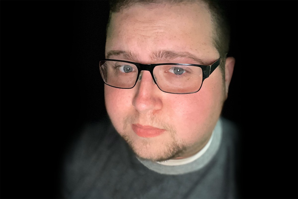 a selfie of a man wearing glasses