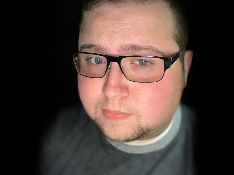 a selfie of a man wearing glasses