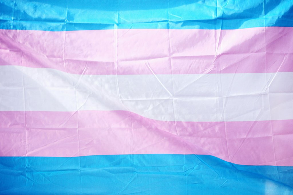 A flag made of blue, pink, and white bars