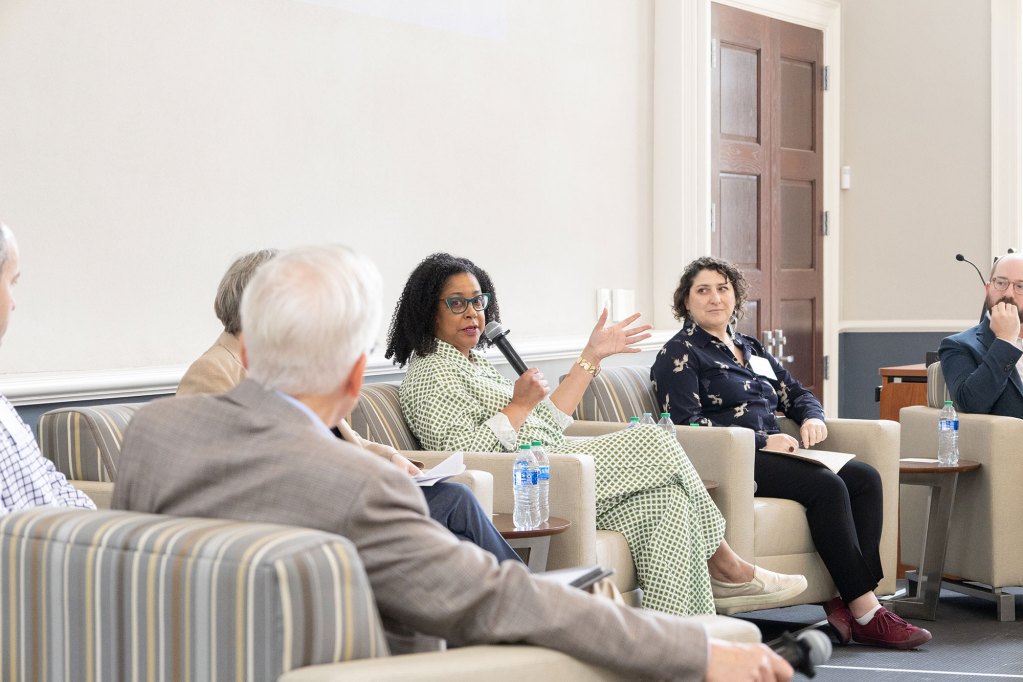 Kimberly Griffin talking to media leaders at a summit meeting