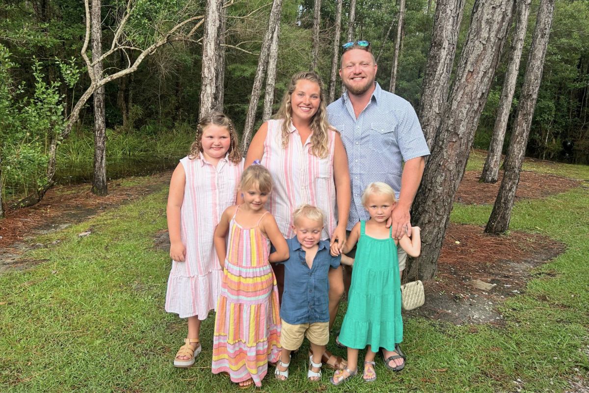 A family of six posed together