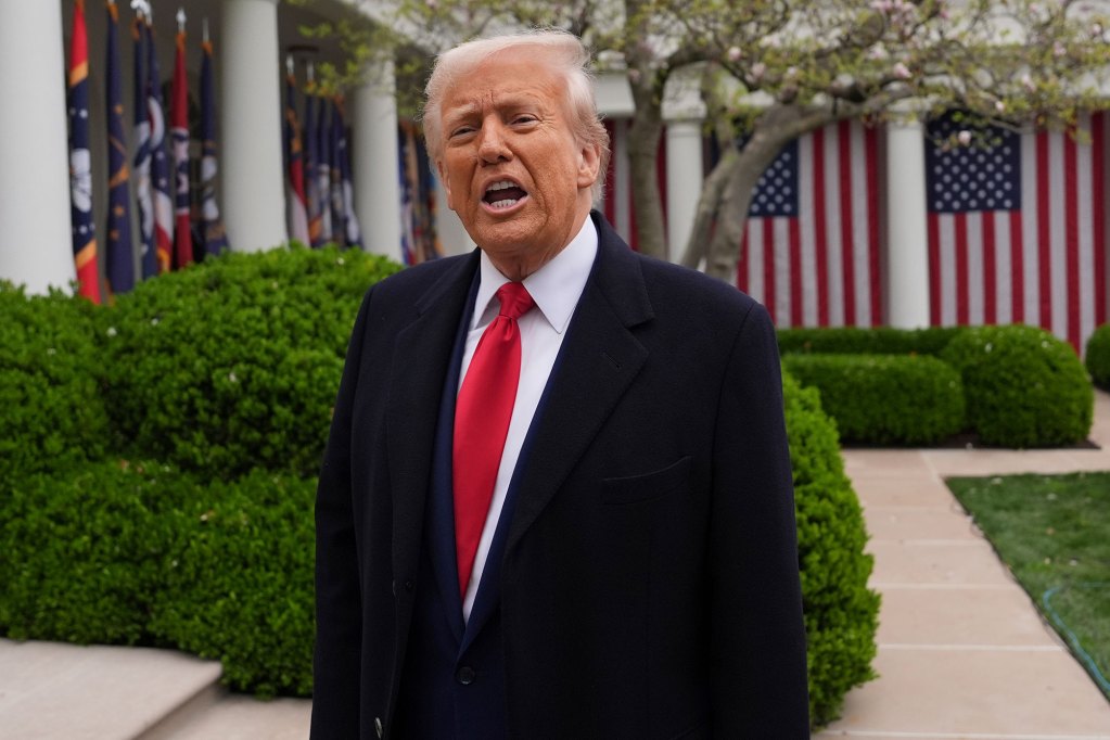 President Donald Trump standing outside, speaking