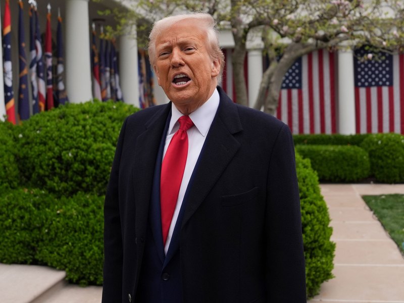 President Donald Trump standing outside, speaking