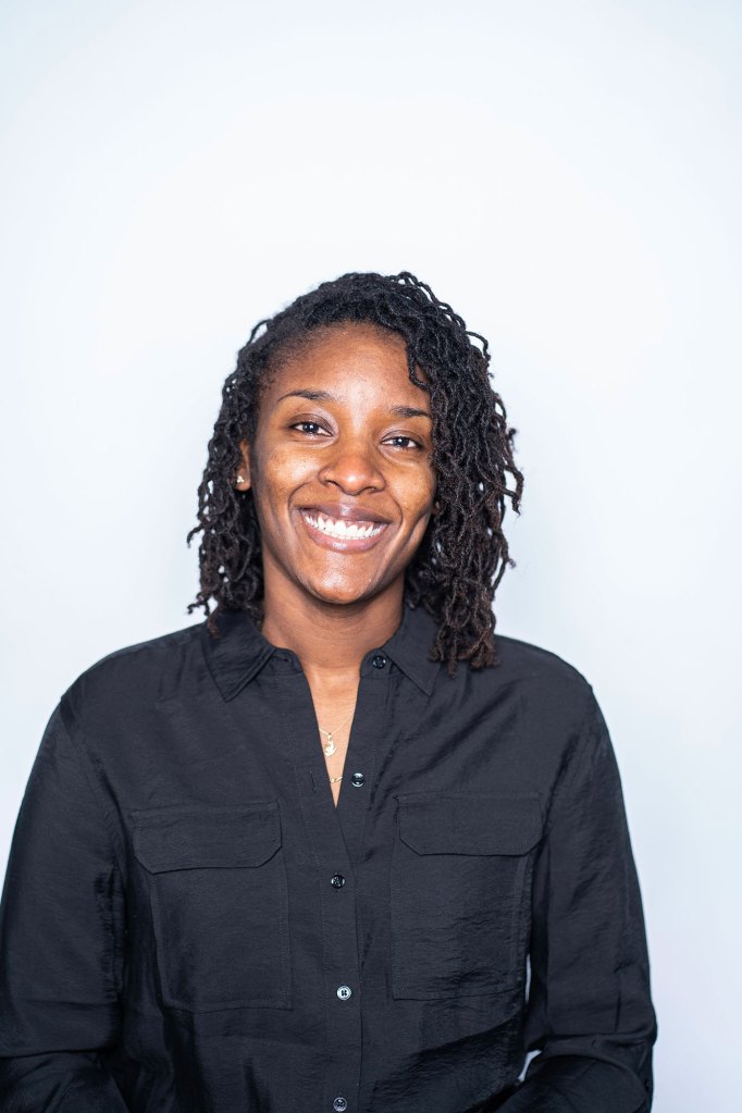 A woman with a black shirt and black hair